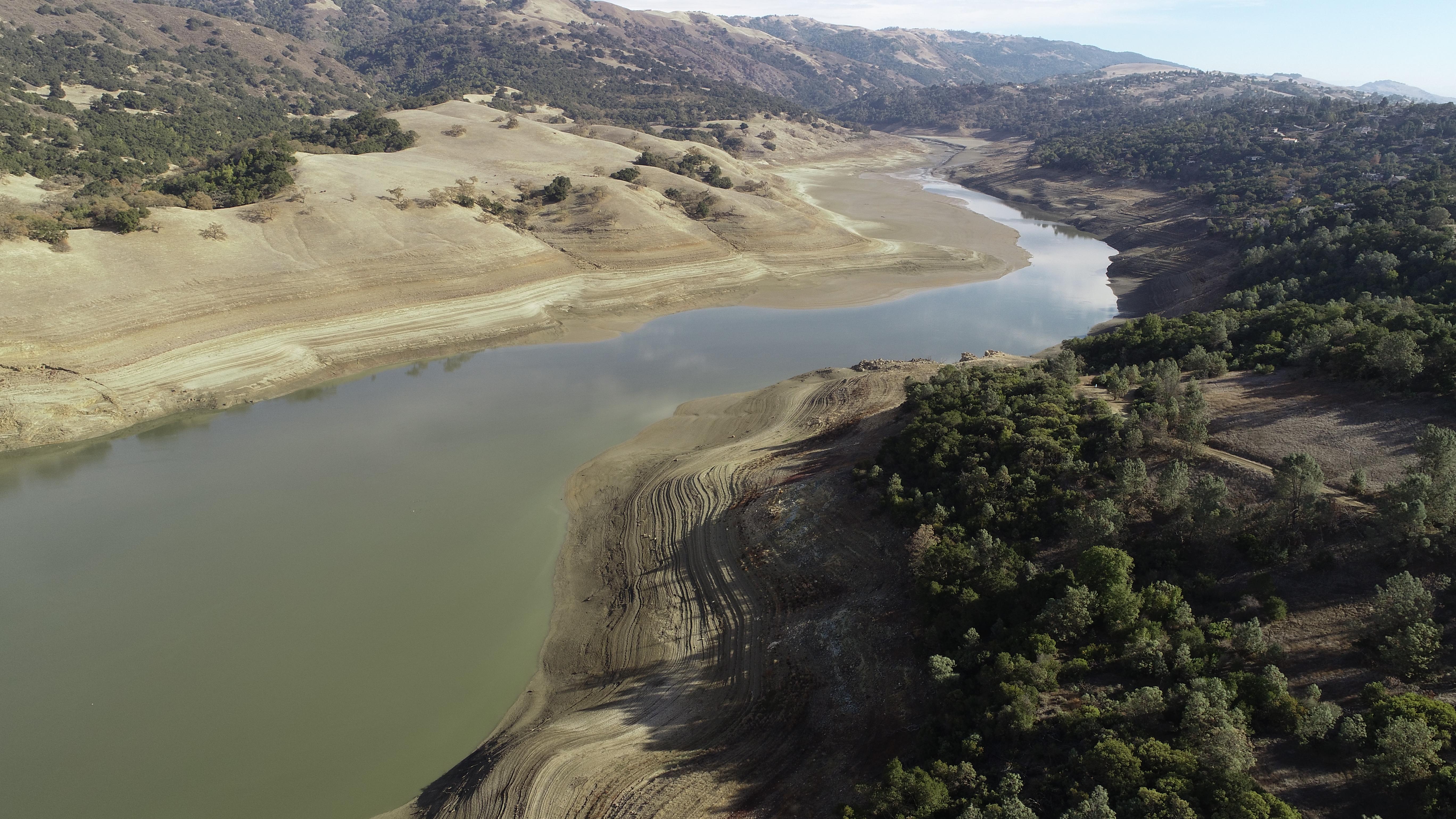 Photo of Anderson Dam with lowered reservoir levels