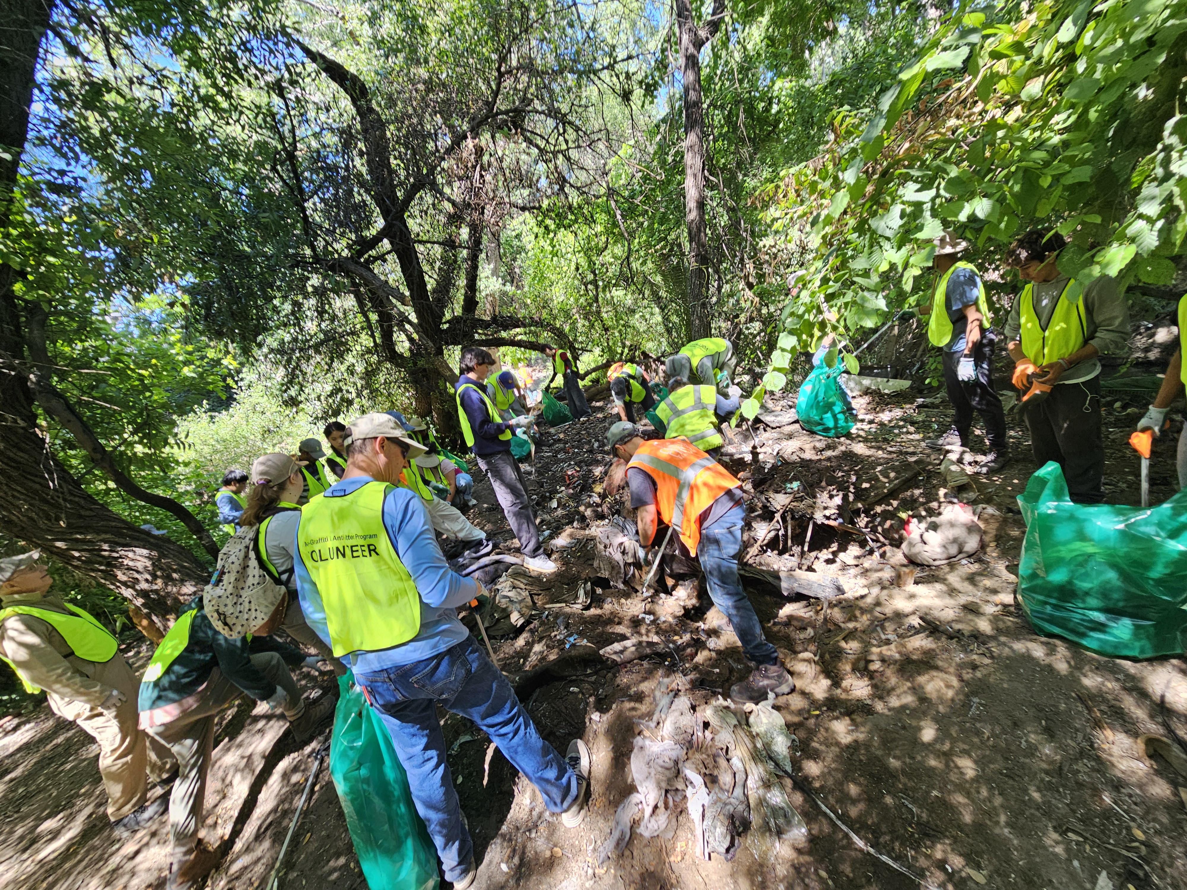 Volunteers remove litter along Coyote Creek in San Jose.