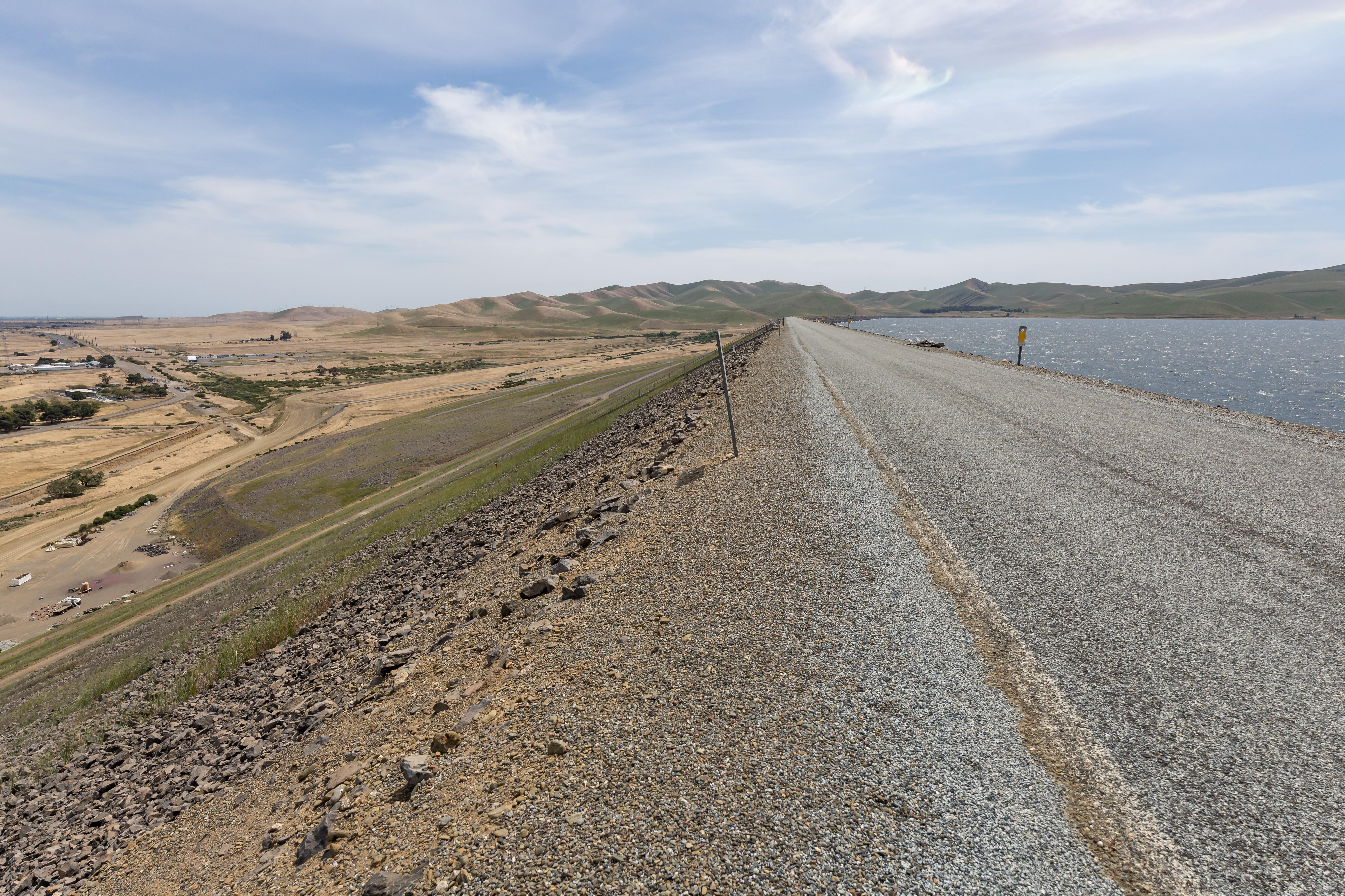 B.F. Sisk Dam is pictured at San Luis Reservoir in Merced County, California. Photo taken April 15, 2025. On this date, the reservoir storage was 1,805,235 AF, or 88 percent of the total capacity. Photo courtesy of Xavier Mascareñas / California Department of Water Resources.