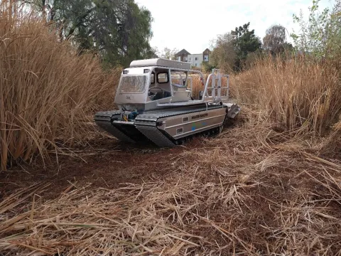 Mechanical vegetation removal on Guadalupe River with amphibious Marsh Master®