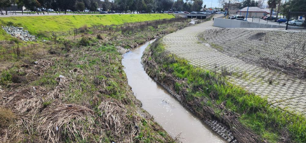 Lower Berryessa Creek facing upstream at Calaveras Blvd and pedestrian trail on the south bank of the creek.