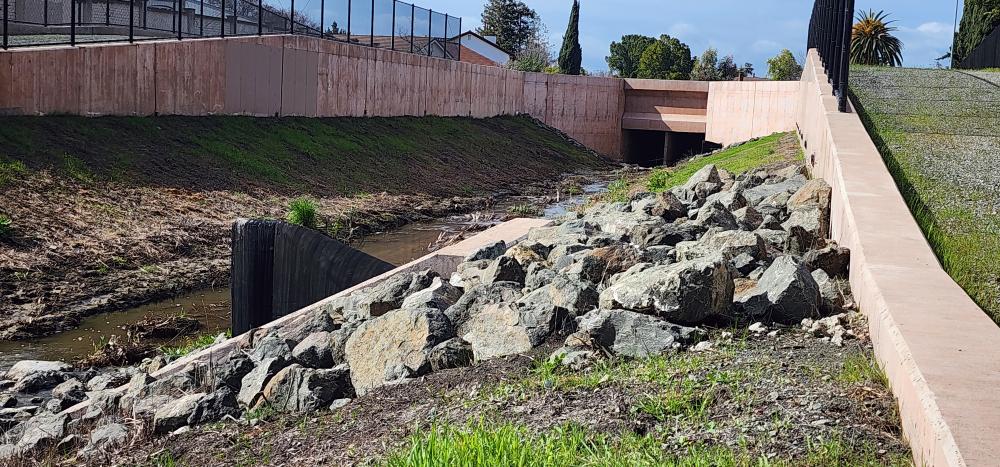 Completed flood protection elements upstream of Calera Creek facing Arizona Ave