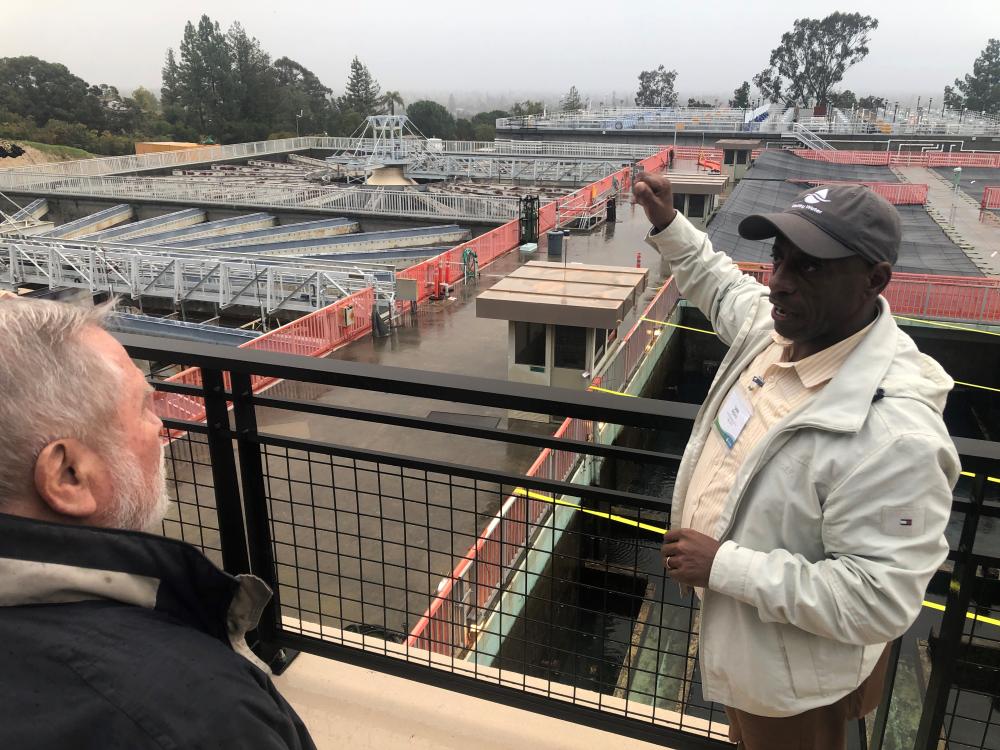 Deputy Operating Officer Sam Bogale speaks to Rinconada neighbors about the clarifiers and how their upcoming demolition will benefit the treatment plant.